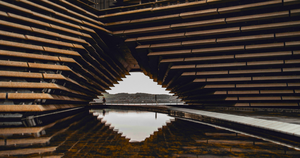 best areas to live or invest in dundee 2026, v&a dundee museum exterior, brutalist architecture with people walking
